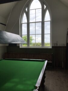 Photo of billiard table and window